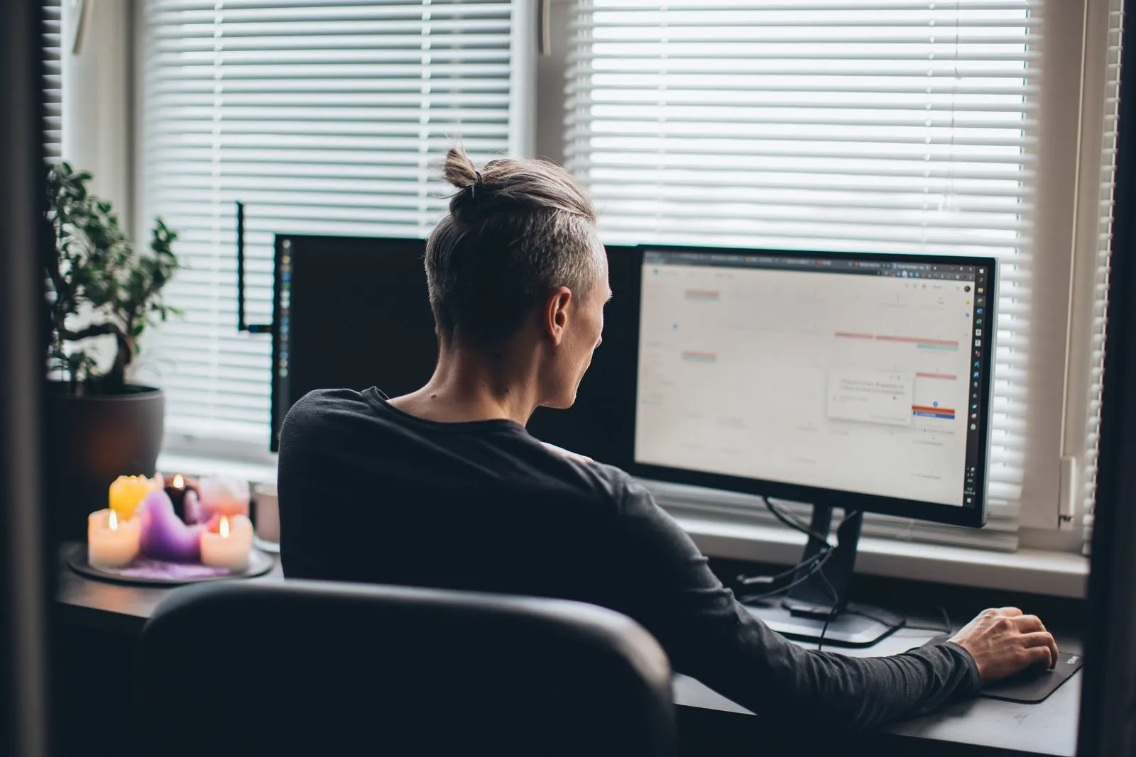 A person analyzing data on a computer screen.