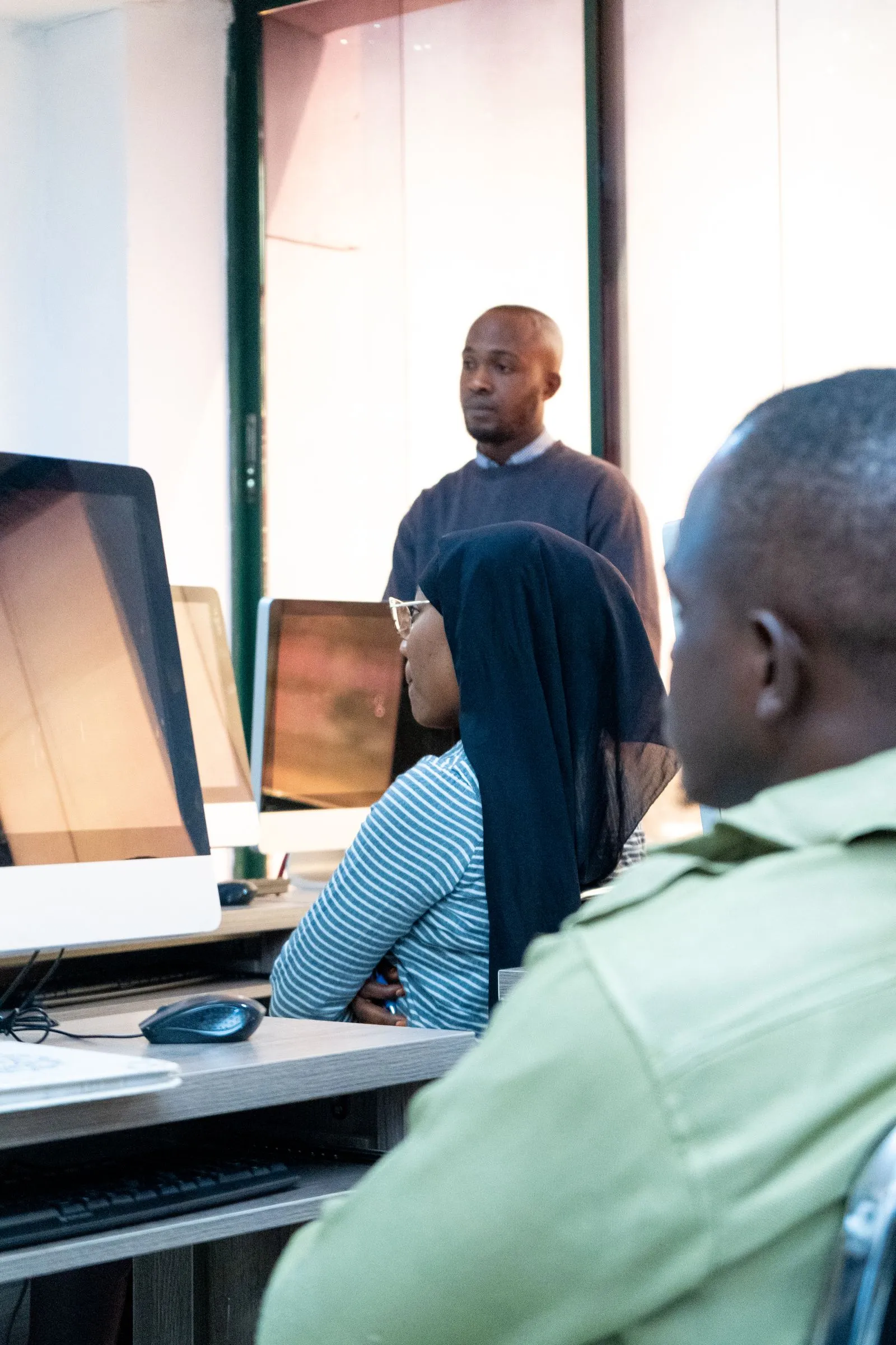 A small group training at computers.