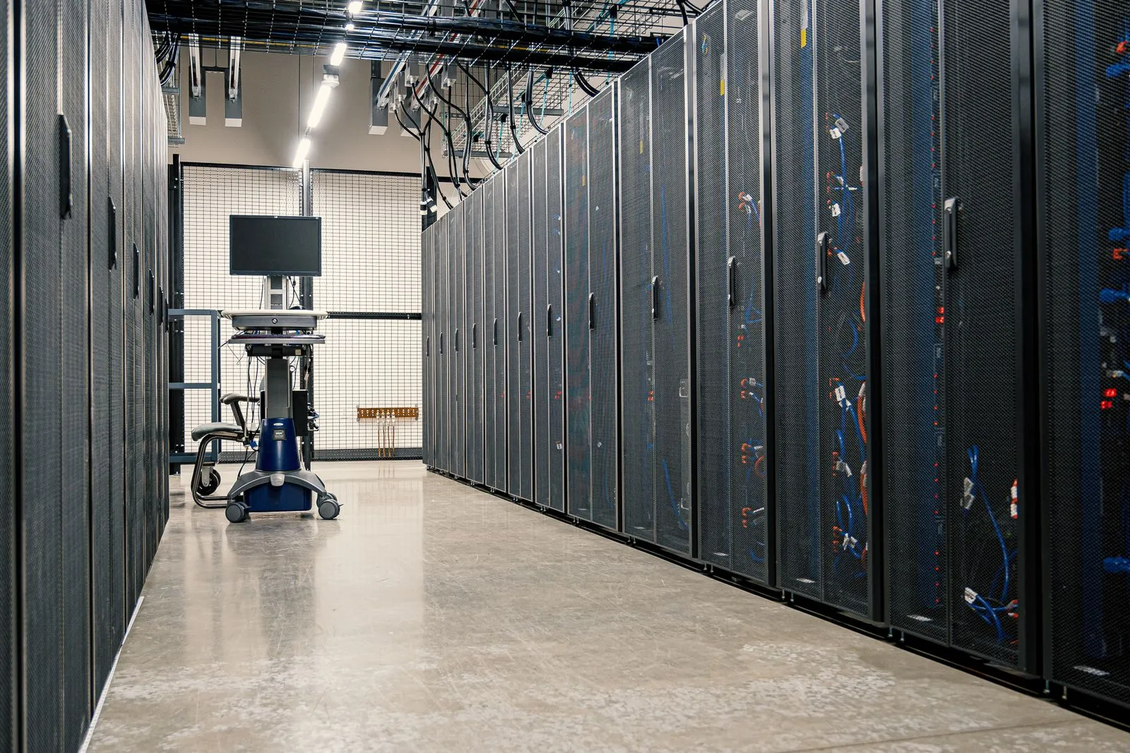 A corridor of server racks in a data center.