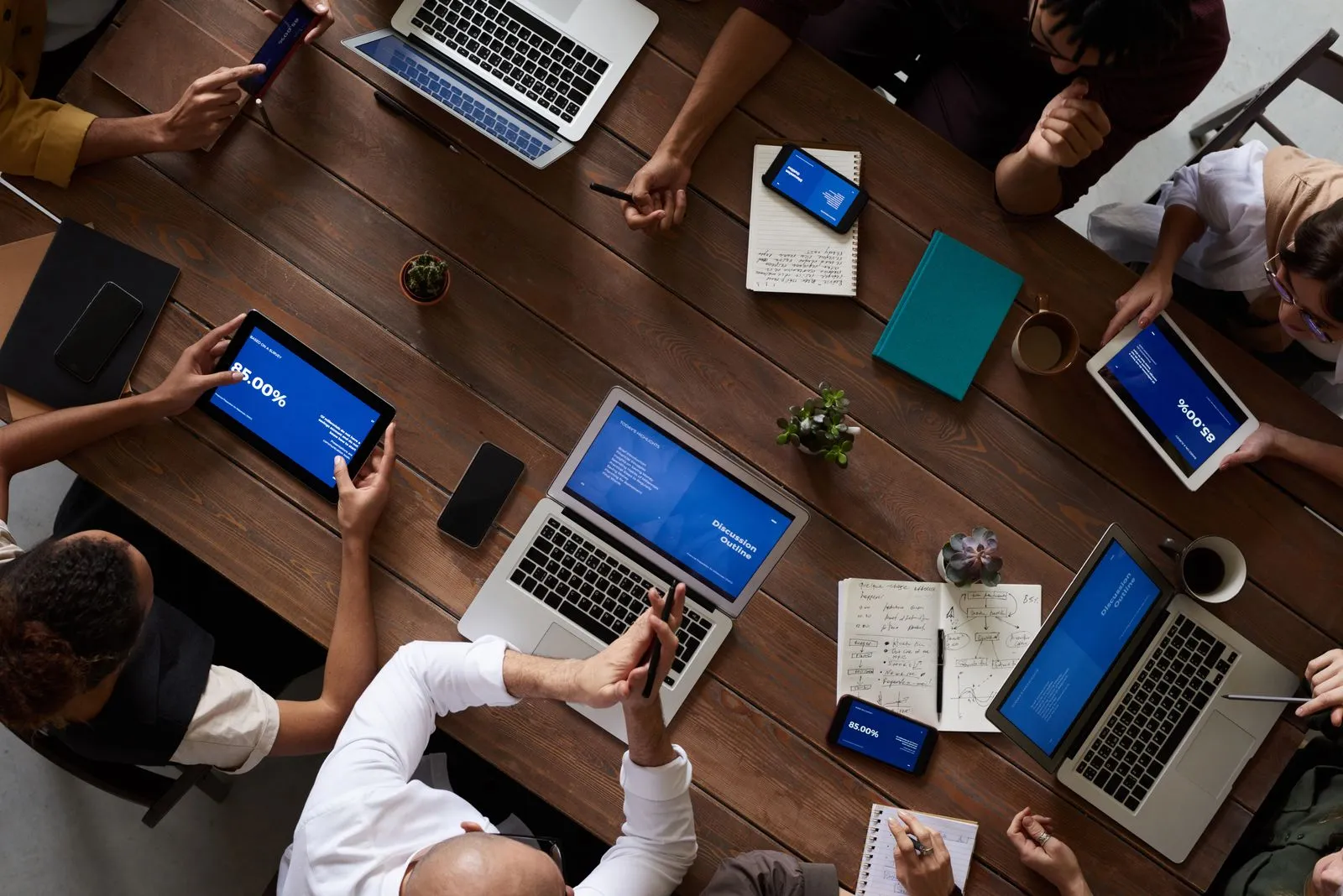 Overhead view of a diverse team working around a table.